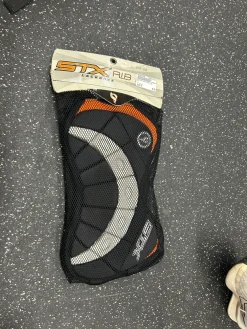 Used STX Lacrosse Rib Pads Black LG